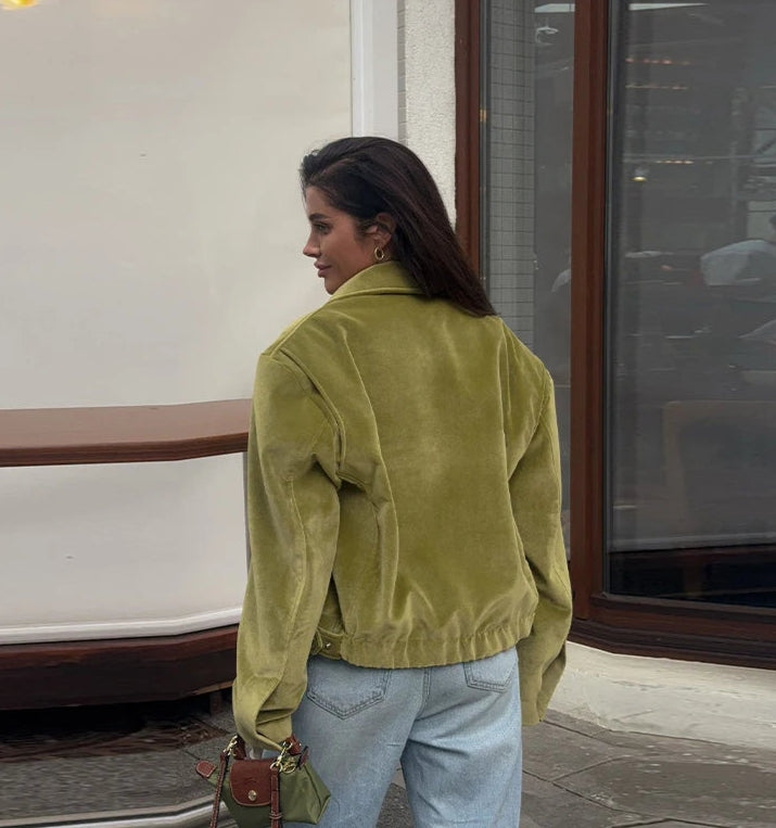 Minimalist green jacket designed for transitional seasons and versatile wear

