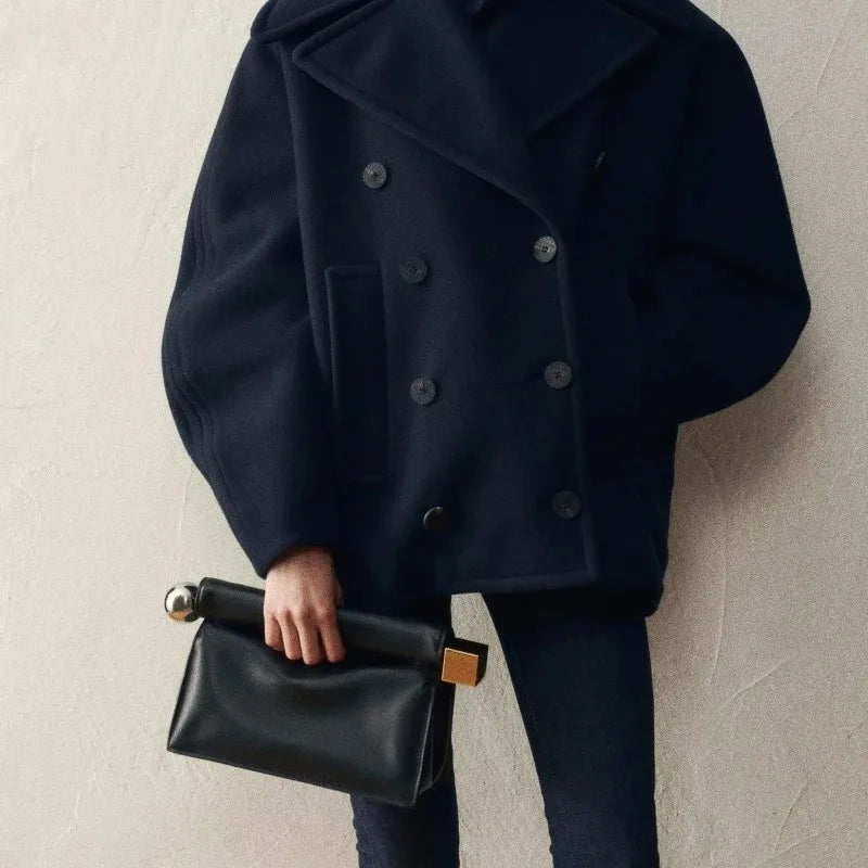 Minimal foldover clutch sized for essentials with clean structured lines