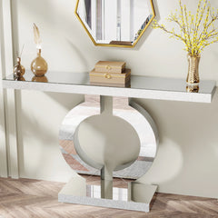 Modern mirrored console table with O-shaped base and glass top

