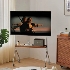 Mobile floor monitor stand holding a TV and laptop