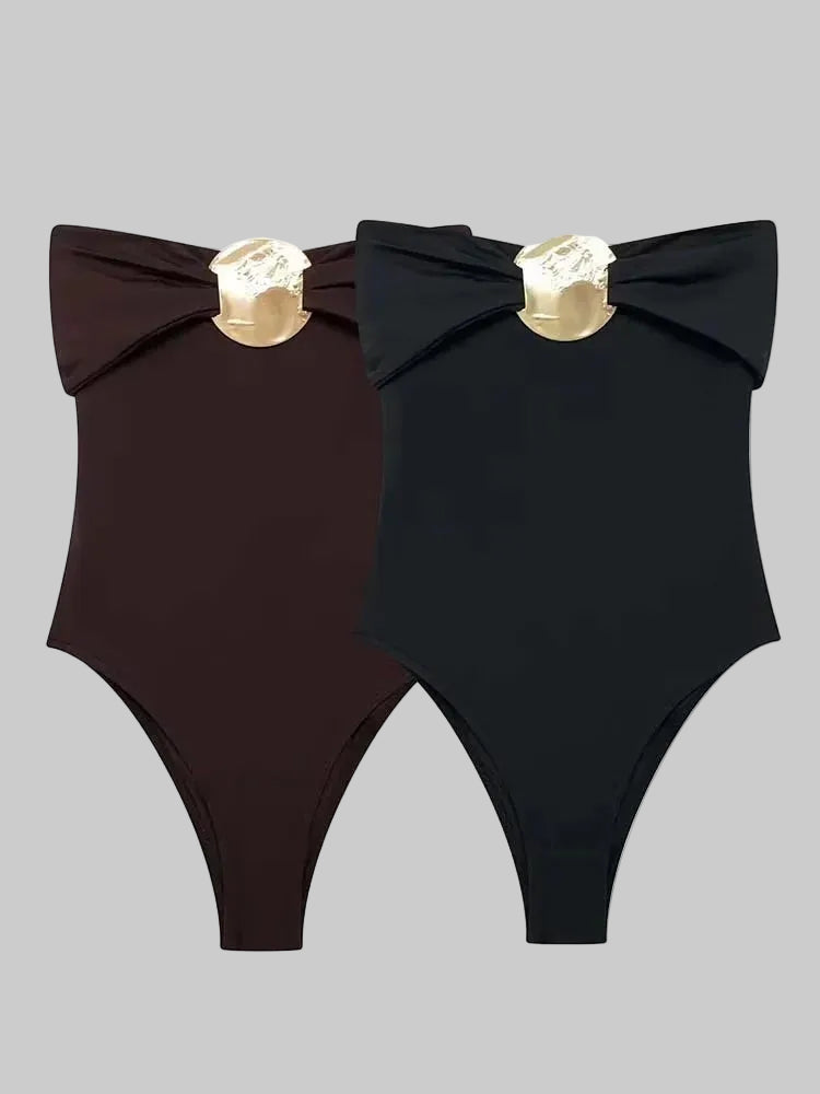 Front view of the slim-fit bodysuit silhouette, highlighting the high-cut leg line and clean, minimalist shape designed for styling with denim.