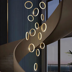 A modern alloy pendant lamp hanging in a living room, providing elegant illumination.