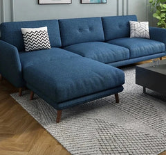 Blue fabric apartment sofa with wooden legs and cushions
