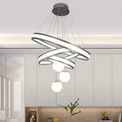 Architectural black pendant chandelier making a statement above a sofa