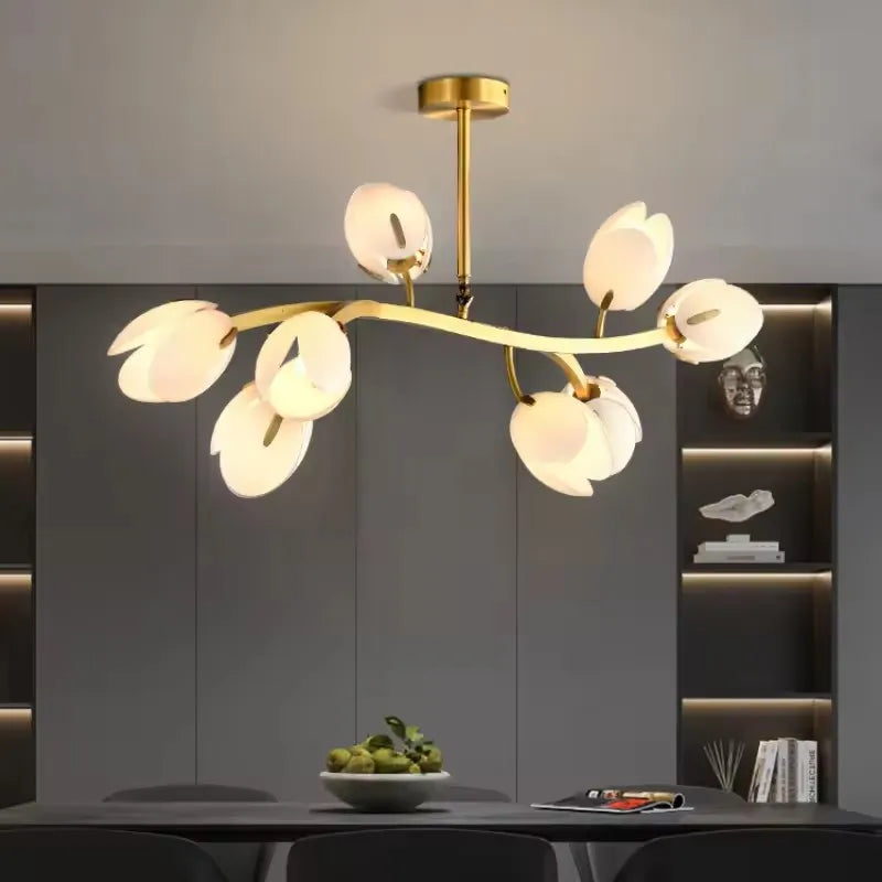 Modern brass flower chandelier with glass petals shown in contemporary space