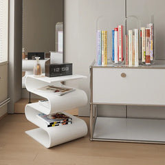 Compact sofa side table holding a tablet and decor