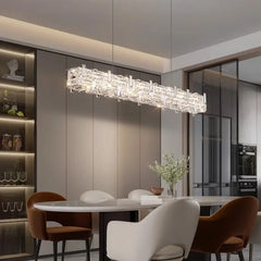 Contemporary crystal chandelier adding sparkle to a dining room