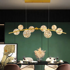 Modern dining room with gold and glass globe pendant lighting