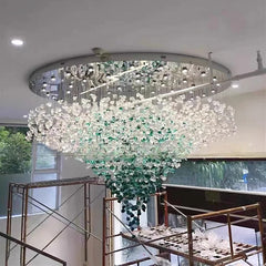 Modern grand ceiling light with cascading green and clear crystals