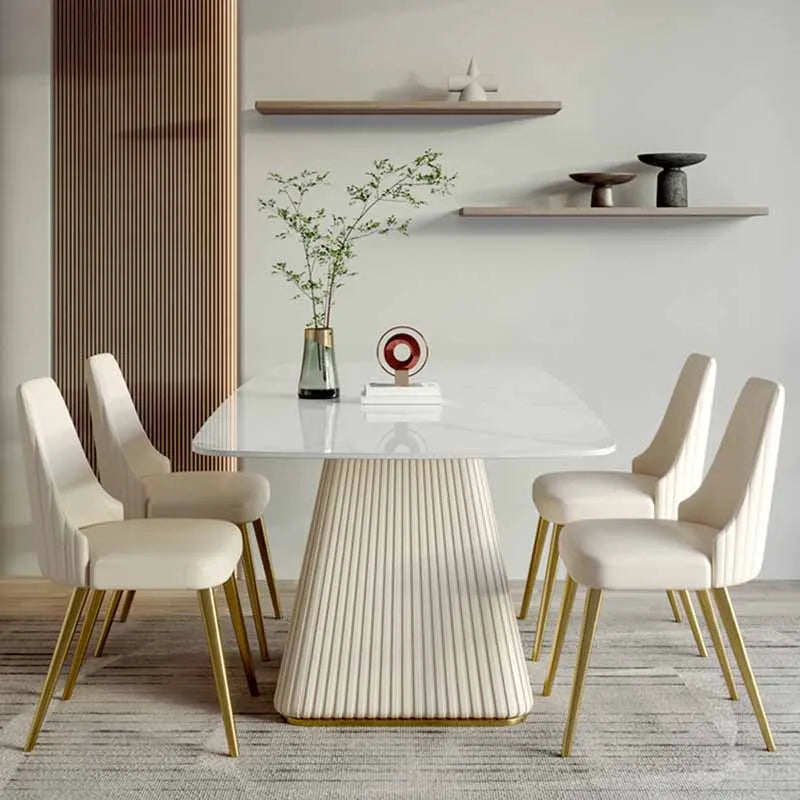 “Modern rectangular dining table with rock slab top and gold fluted base”

