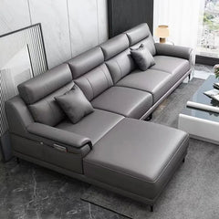 Modern L-shaped leather sectional sofa with chaise in living room