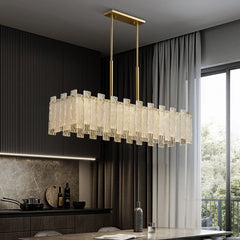 Modern LED copper pendant lighting suspended above a dining room