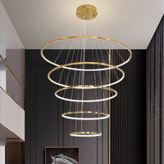 A modern LED pendant light hanging in a living room, providing elegant illumination.