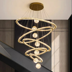 Modern LED pendant light shown above staircase with alloy spiral frame hanging from the ceiling.