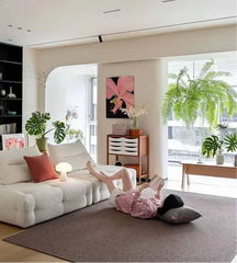 Modern lounge setup with cream velvet couch 