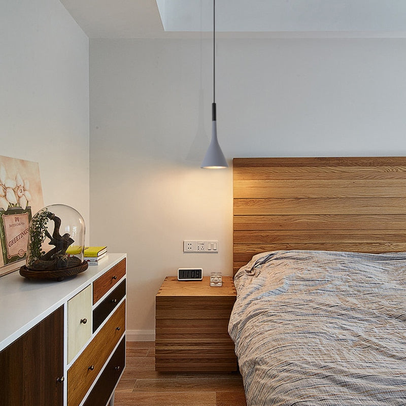 Grey Led painted iron Nordic LED pendant light hanging in a modern bedroom.