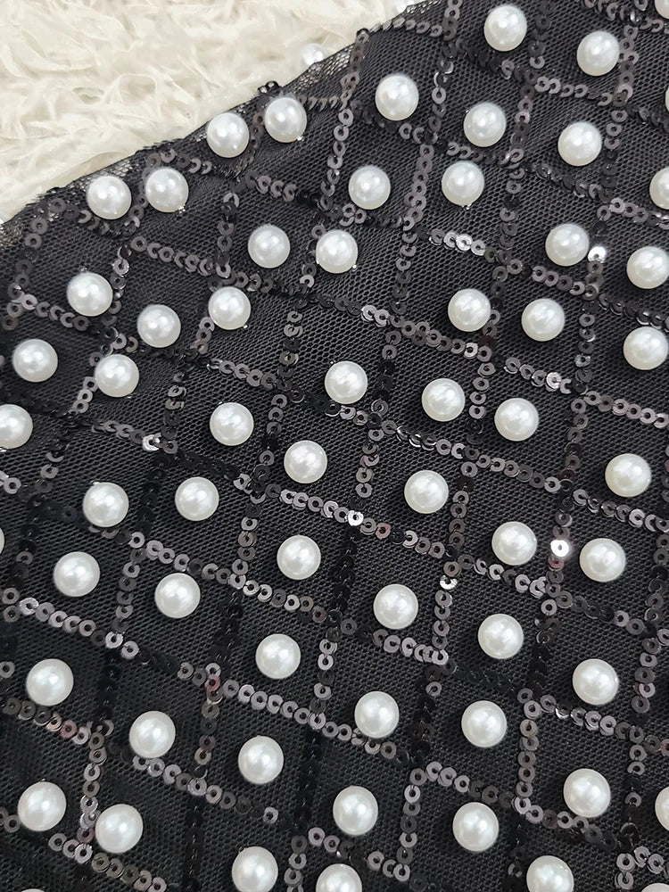 Modern one shoulder dot dress designed for statement retro-inspired events