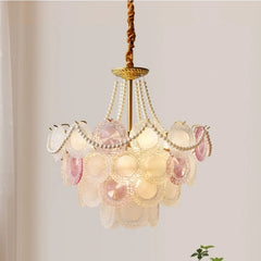 Prismatic glass chandelier styled for a cozy bedroom reading nook