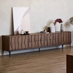 “Modern entertainment console styled with decor and abstract art”