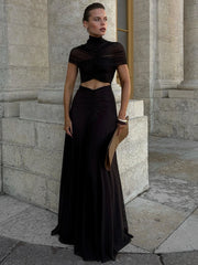 An O-neck club dress styled with heels and a clutch.