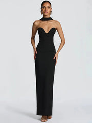 Woman wearing a black strapless gown on a white background