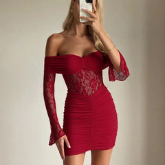 Lace panel party mini dress styled near a piano with off-shoulder neckline