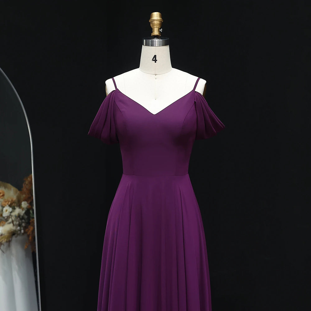 Outdoor wedding setting featuring a purple floor-length bridesmaid dress with V-neckline