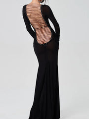Open back applique spring formal gown shown for elegant party occasions with modern accessories  on a white background
