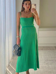 Woman wearing green ribbed knit open back midi dress