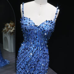 Close view of sequin detailing and fitted mermaid shape on gown