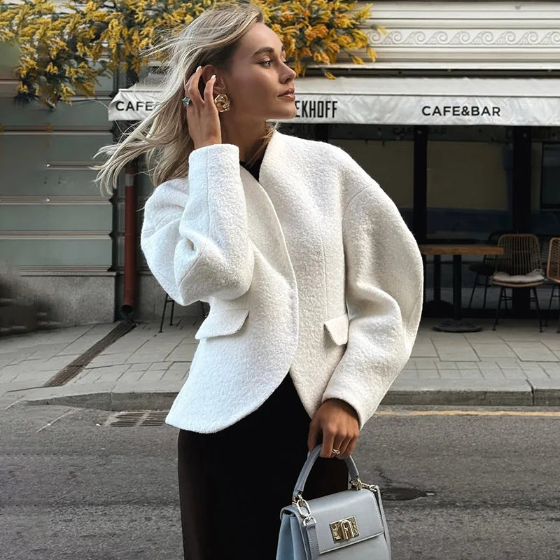 The full length of the cardigan jacket, showing its loose and relaxed fit.