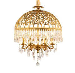 Openwork brass crystal lamp suspended in a boutique hotel suite