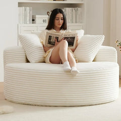 “Oversized 55 inch round chaise chair with corduroy fabric in white”

