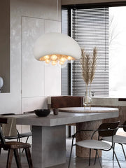 Oversized white mushroom style pendant in a contemporary dining room