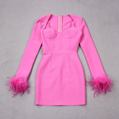 A Pink long sleeve mini bodycon dress with feathers on the sleeves.