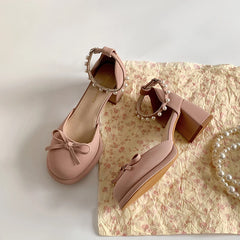 Pink Mary Jane pumps with pearl ankle buckle and bow detail