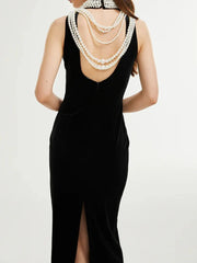 Black velvet formal dress with classic pearl back draping