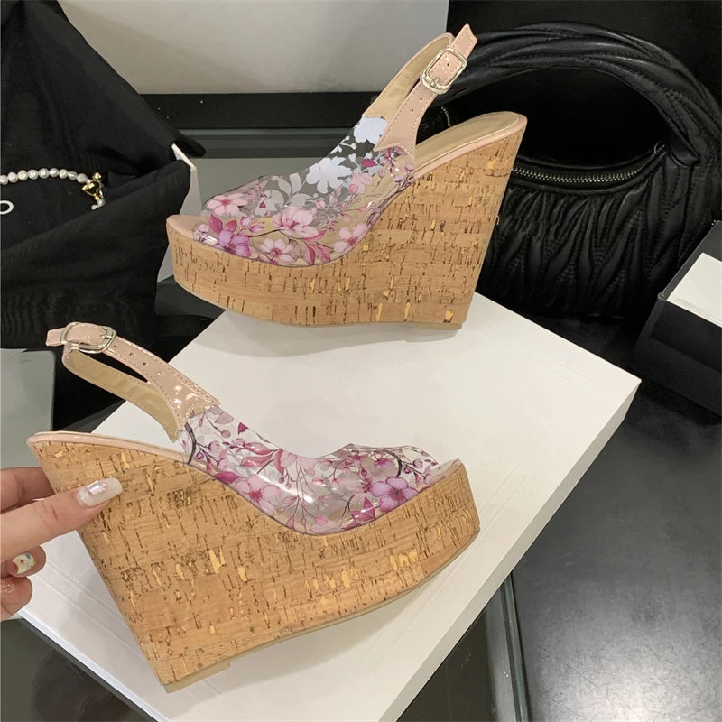 Woven wedge sandals with floral design on a white surface