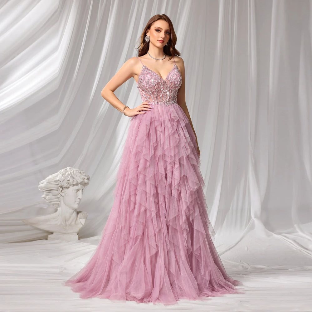 Pink A-line evening gown with V-neck beaded bodice on model