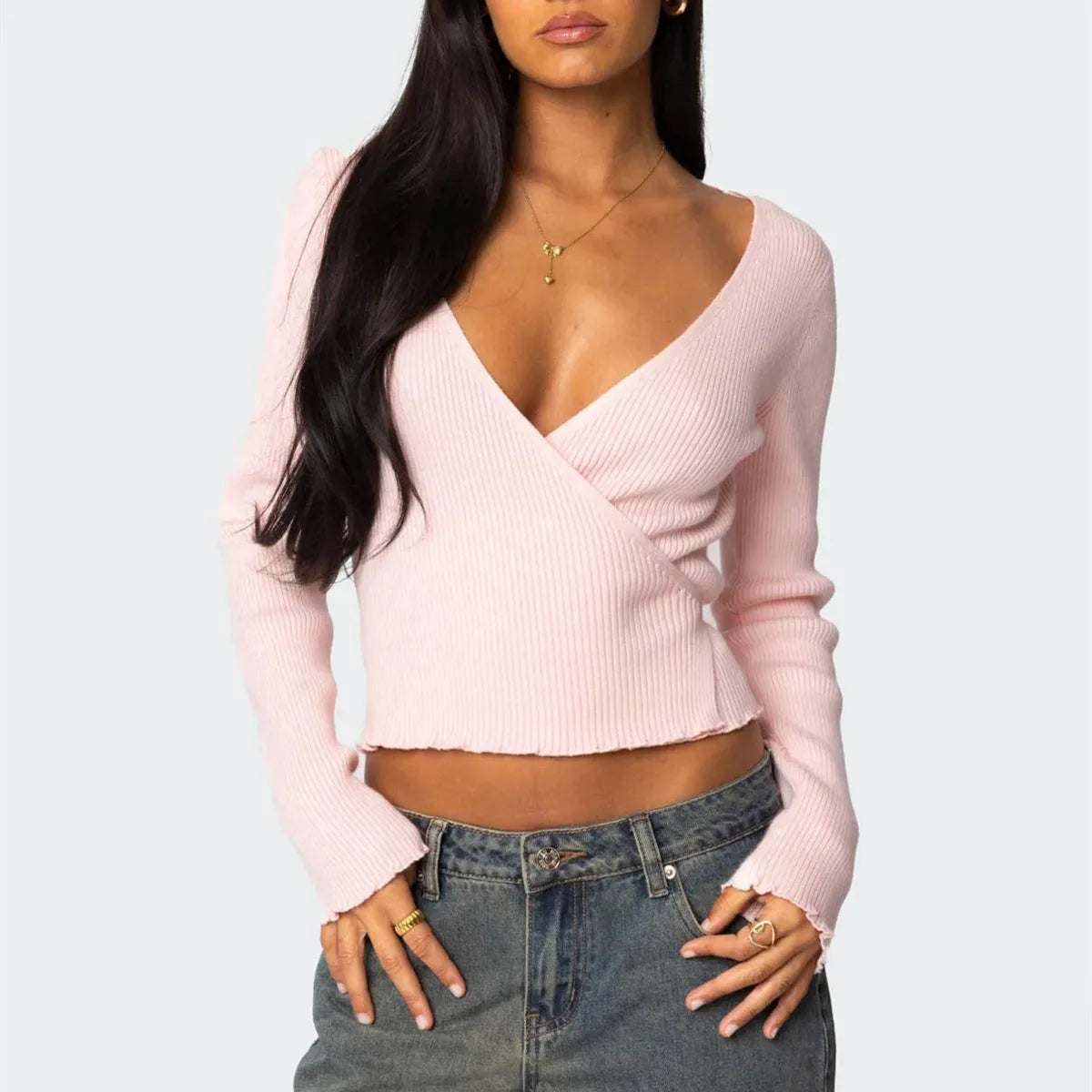Slim pink ballet wrap sweater with ribbed texture and V-neckline