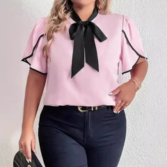 Feminine pink and black summer top with lace-inspired texture