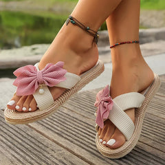 Front view of women’s pink bowknot cross strap summer slides