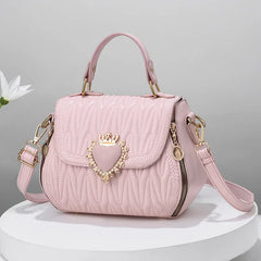 Close-up of PU leather crossbody bag with embroidery details