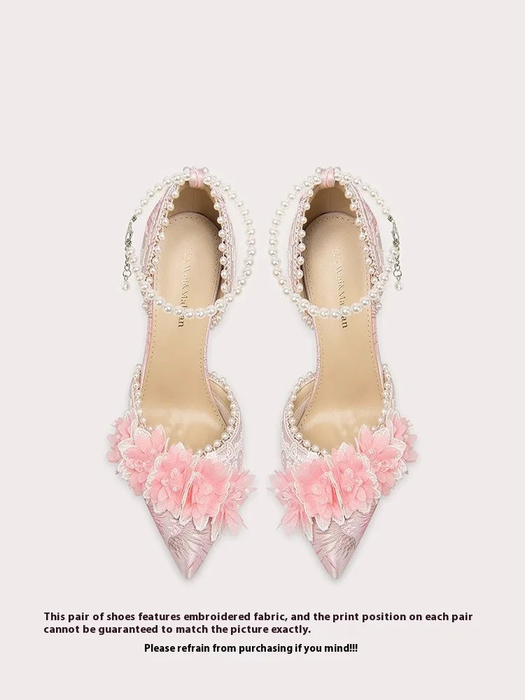 Pink floral bow heel shown in extended sizes for garden party dressing on a light background