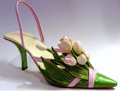 Pink ribbon slip high heel party shoe with sculpted tulip flower accents on a white background