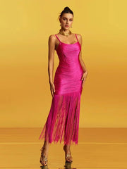 Fringe hem detail in motion, highlighting the tassel length and the ankle-grazing finish as the dress catches the light.