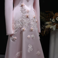 Pink tulle floral gown styled for weddings and parties,  lace dress with floral embellishments on a dark background