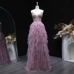 Floor-length formal dress with tiered ruffle skirt and embellished top