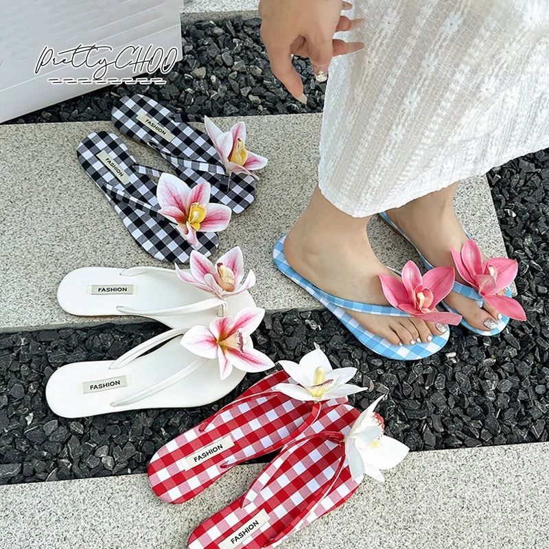 Plaid floral flip flops styled for casual summer wear, ' FASHION' label on a checkered and solid background
