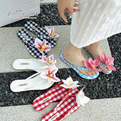 Plaid floral flip flops styled for casual summer wear, ' FASHION' label on a checkered and solid background